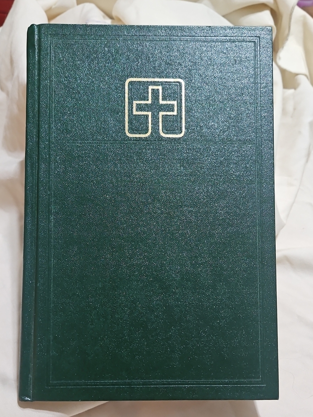 Hardcover Lutheran Book of Worship, referred to as the "green book".